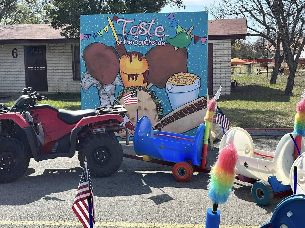 The colorful Doodle Train cars and towing vehicle ready to carry families at a San Antonio community event